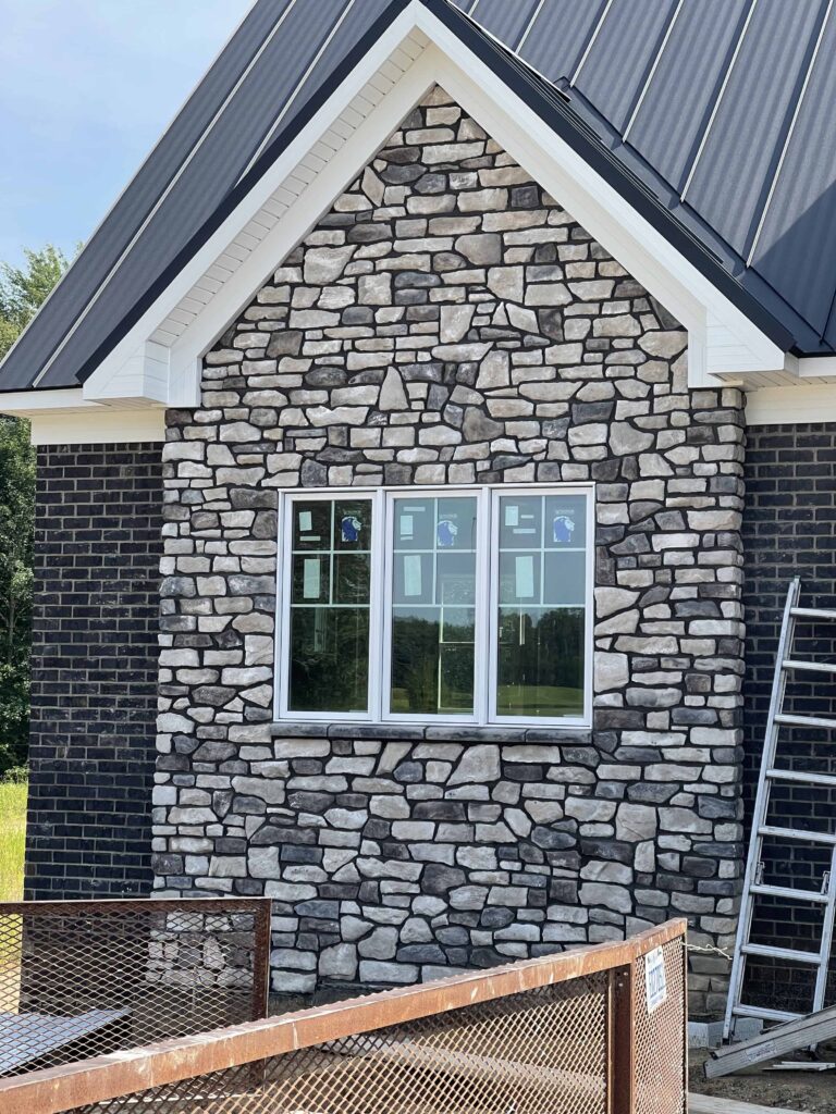 New Stone Siding Image Gray House with white facia
